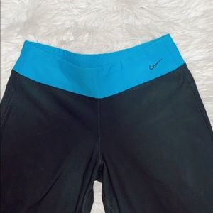black nike bootcut yoga pants w/ blue waistband